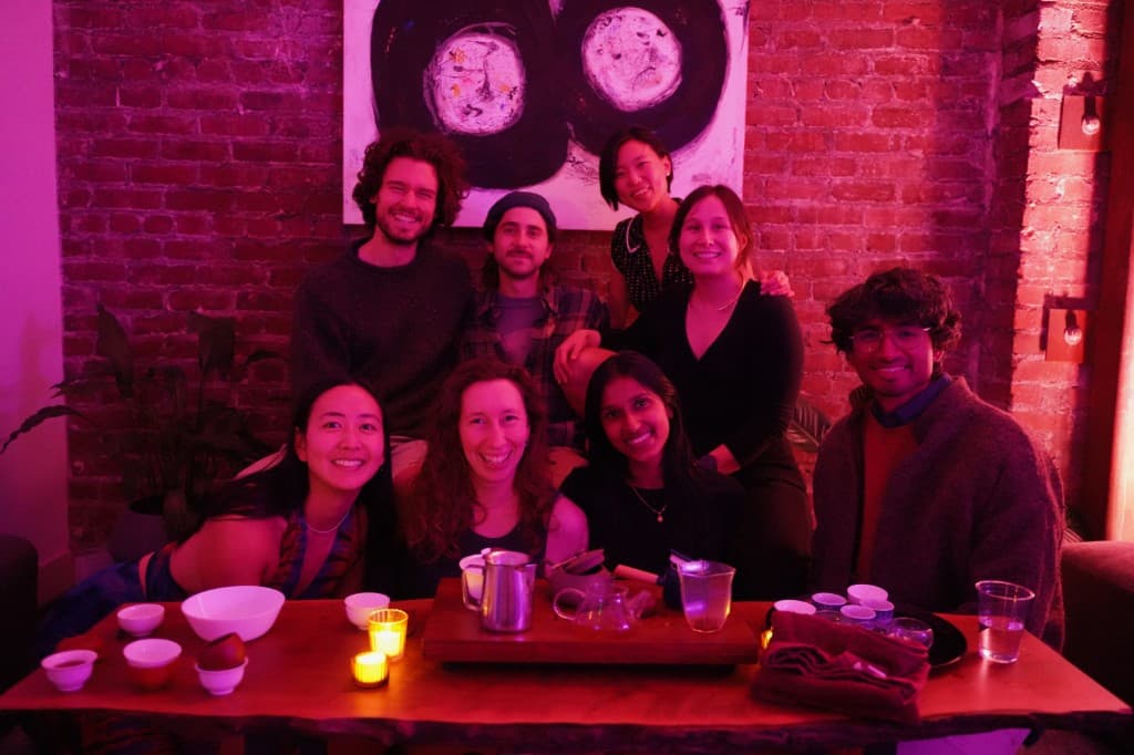 The Midnight Teahouse team gathered around a low tea table
